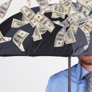 A man standing under an umbrella with money raining down