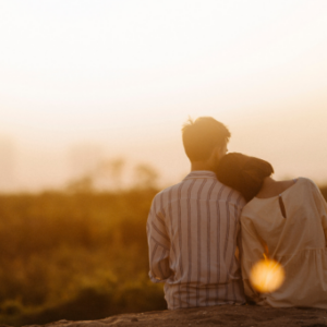 Couple embracing watching a sunset