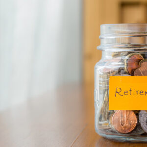 Jar of coins with the words "retirement" written
