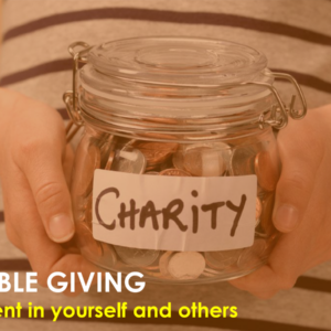 Person holding air tight jar with coins labelled "Charity"